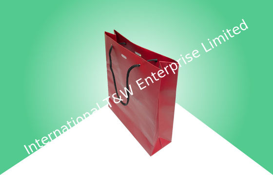 Harga yang bagus Kantong belanja kertas yang kuat dengan pegangan logo yang disesuaikan on line